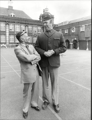 Actor Bernard Bresslaw With Journalist Jack Pleasant In Playground Of Their Old School Cooper's Company's School For Boys (now A Girls School) In The East End Of London Bernard Bresslaw (25 February 1934 A 11 June 1993) Was An English Actor. He Is