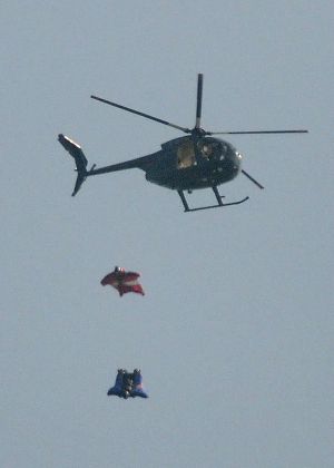 Gary Connery becomes first man to jump out of helicopter in wingsuit and land without deploying parachute, Britain - 23 May 2012