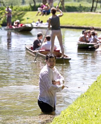 Man Takes Dip Fully Clothed While Editorial Stock Photo - Stock Image