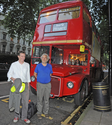 Author Alexander Masters (in White Shirt) And The Subject Of His Book Simon Norton (blue T-shirt) Board A Red Routemaster Bus Near Paddington Station Tonight At The Book Launch For The Book 'the Genius In My Basement'. Mr Norton Is Quite An Eccentr