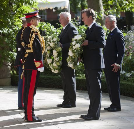 U.s. Ambassador To Great Britain Louis Susman (c) And Prime Minister David Cameron (2nd R) Prepare To Lay Wreaths Under The Eye Of Prince Charles (r) As They Attend A Ceremony For Victims Of The Attacks On The World Trade Centre In New York Marking T
