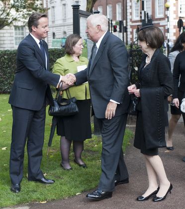 The Prime Minister David Cameron Meeting The U.s. Ambassador Louis Susman And His Wife Marjorie At A Memorial Ceremony At The Sept 11 Memorial Gardens In Grovesnor Square In London.