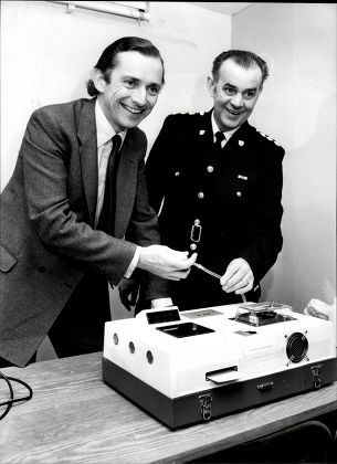 Norman Fowler Baron Fowler Of Sutton Coldfield Tries The New Breathalyser Machine With Chief Inspector Derek Hunt Of Sussex Police.