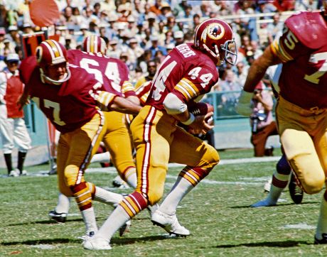 Washington Redskins full back John Riggins (44) runs over