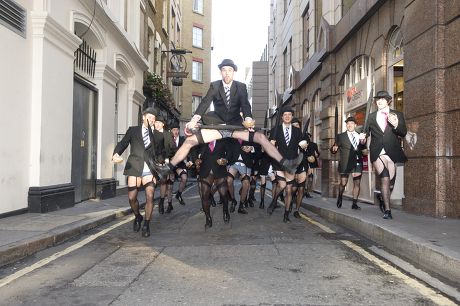 SEMI NAKED BUSINESS WOMEN PARADE THE STREETS OF LONDON IN BUSINESS SUITS  AND EXPOSED STOCKINGS KNICKERS AND BRAS Stock Photo - Alamy