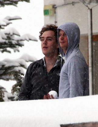 Prince Harry And A Friend Tom Inskip Throw Snowballs From A Hotel Balcony At The Swiss Resort Of Verbier.