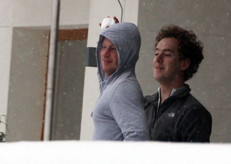 Prince Harry And A Friend Tom Inskip Throw Snowballs From A Hotel Balcony At The Swiss Resort Of Verbier.