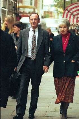 Richard Pearce 53 A Senior Law Society Official At Horseferry Magistrates Court With His Wife. He Has Been Charged With Harassing A Fellow Passenger While Travelling To London From His Home In Hampshire.
