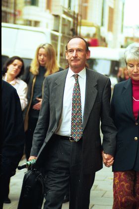 Richard Pearce 53 A Senior Law Society Official At Horseferry Magistrates Court With His Wife. He Has Been Charged With Harassing A Fellow Passenger While Travelling To London From His Home In Hampshire.