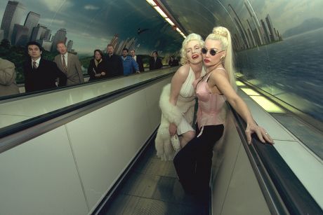 Marilyn Monroe Look-a-like Pauline Bailey With Madona Look-a-like Lorelei Lee In Front Of The American Airlines Mural At The Bank Tube Station.
