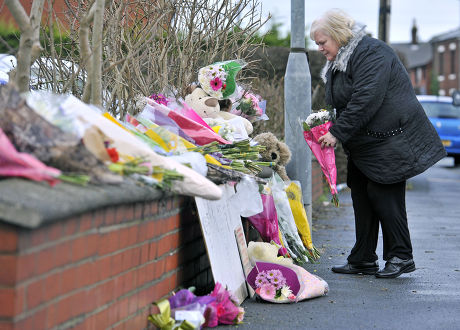 Flowers Are Brought To The Scene Of A House Fire In Freckleton Lancs Which Killed Four Year Old Twins Holly Smith And Ella Smith Jordan Smith 2 And Brother Reece Smith 19. Pic Bruce Adams / Copy Chamberlain - 9.1.12.