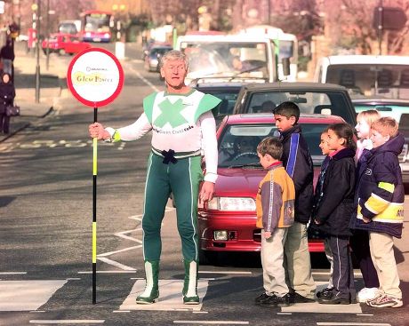 Dave Prowse The Green Cross Road Man Back At His Job With Kids From Our Lady Of The Visitation School Greenford At The Abbey Road Zebra Crossing In Support Of The National Road Safety Initiative.