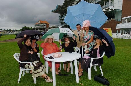 Ladies Day At Royal Ascot Horse Racing Meeting Which Is Being Held At York Because Of A New Stand Being Built At Ascot. Braving The Weather (l To R) Susan Sharp (a Pa From Bradford) Jan Hatfield (a Beauty Therapist) Barbara Breadbury Kay Beaumont Noe