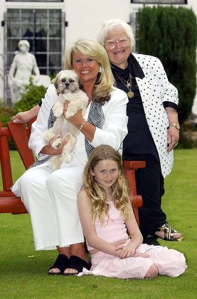 Feature On Tracy Dawson Wife Of Comedian Les Dawson- Tracy Dawson With Her Daughter Charlotte Dawson 10 And Dog 'lucy' Along With 'roly Poly' Dancer Mo Moreland (top Right) At Their Home In Lytham St Annes Near Blackpool.