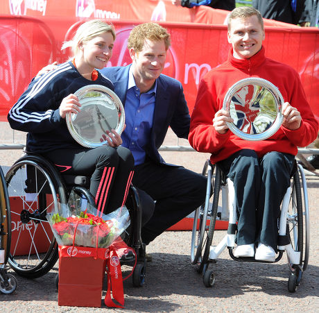 Prince Harry With The Elite Winners Of Today's London Marathon Wheelchair Race David Weir (r) And Shelly Woods (l). Prince Harry Is Presenting The Prizes To The Winners Of Today's Race.