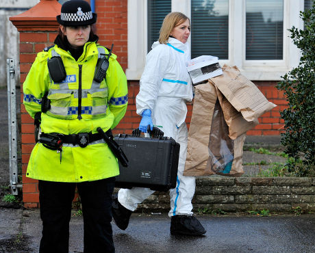 Forensic Staff Leave With Evidence Bags As They Continue Their Work At The Scene Of A House Fire In Freckleton Lancs Which Killed Four Year Old Twins Holly Smith And Ella Smith Jordan Smith 2 And Brother Reece Smith 19. Pic Bruce Adams / Copy Chamber