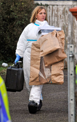 Forensic Staff Leave With Eveidence Bags As They Continue Their Work At The Scene Of A House Fire In Freckleton Lancs Which Killed Four Year Old Twins Holly Smith And Ella Smith Jordan Smith 2 And Brother Reece Smith 19. Pic Bruce Adams / Copy Chambe