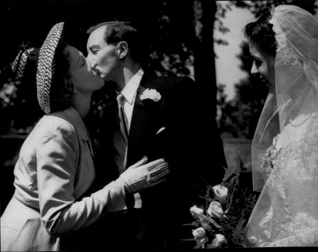 Actress Anne Crawford Kissing Her Brother Thomas After His Wedding To Martha Maclean In Edinburgh.