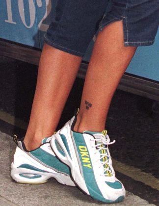 ULRIKA JONSSON'S ANKLE TATTOO SHOWING THE THREE CROWNS SWEDISH NATIONAL EMBLEM, LONDON, BRITAIN - 1998