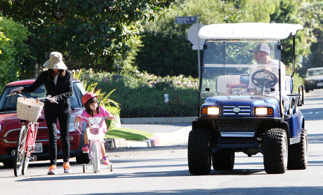 Adam Sandler watches his daughter ride her new bicycle, Los Angeles, America - 15 Sep 2013
