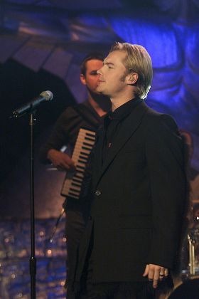 Denise Van Outen with Ricky Martin performing his single "Livin La Vida Loca" at the 1999 Record of the Year Awards.