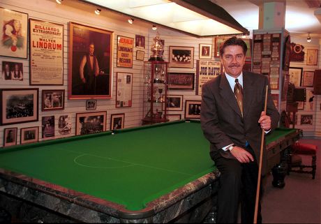 CLIFF THORBURN WITH THE SOLID MARBLE SNOOKER TABLE WHICH IS BEING AUCTIONED FOR CHARITY BY INTERNET AUCTIONS SITE BLUECYCLE.COM