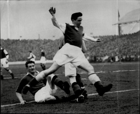 Hibernian Footballer Bobby Johnstone (front) Beats Woodburn (on Ground Robert Johnstone (7 September 1929 Oo 22 August 2001) Was A Scottish Association Football Player Mainly Remembered As One Of The Famous Five Forward Line Of Hibernian. In Hibs' R