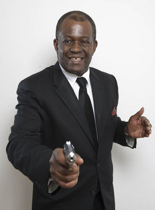 Daily Mail Showbiz Reporter Baz Bamigboye Dressed As James Bond Complete With Walther Ppk Gun.
