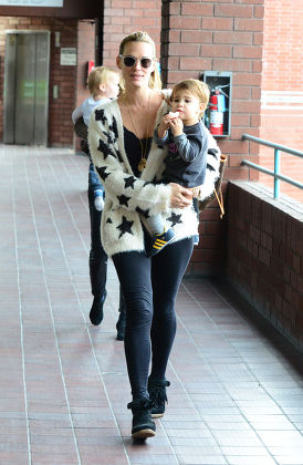 Molly Sims carries her son Brooks in her arms as they go for a car journey  Featuring: Molly Sims,Brooks Stuber Where: Los Angeles, United States When:  12 Mar 2014 Stock Photo - Alamy