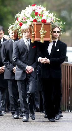 Crispian Mills (l) And Ace Lawson Carry The Coffin. Funeral Of Sir John Mills At The Parish Church Of St Mary The Virgin Denham Bucks.