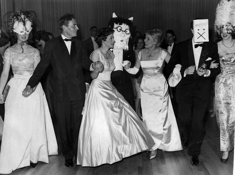 Actress Ann Todd And James Mason Join In A Palais Slide After Choosing The Winning Masks A The League Of Pity Ball At A Mayfair Hotel.