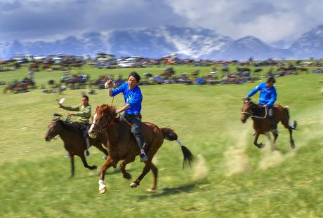 Herding Yili horses across the Kunes grassland, Xinyuan County, China ...