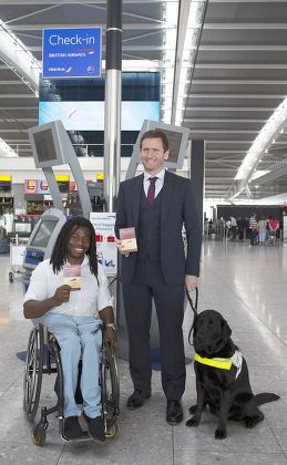 Passport sized air travel guide for disabled passengers photocall at Heathrow Airport, London, Britain - 29 Jul 2014
