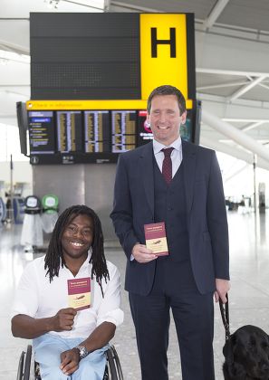 Passport sized air travel guide for disabled passengers photocall at Heathrow Airport, London, Britain - 29 Jul 2014