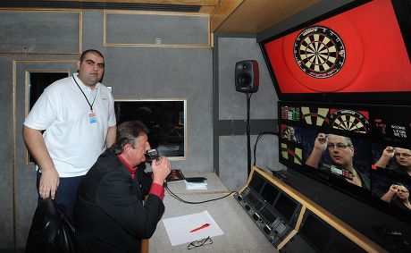 Sunni Upal Behind The Scenes At Pdc Darts. Pictured With Eric Bristow. Pdc World Darts Championship December 13th 2013. Credit Image: Kevin Quigley/daily Mail/solo Syndication.