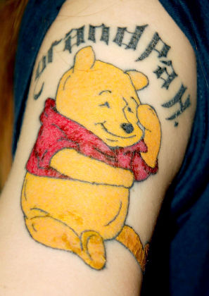 Pooh bear tattoo on the ankle