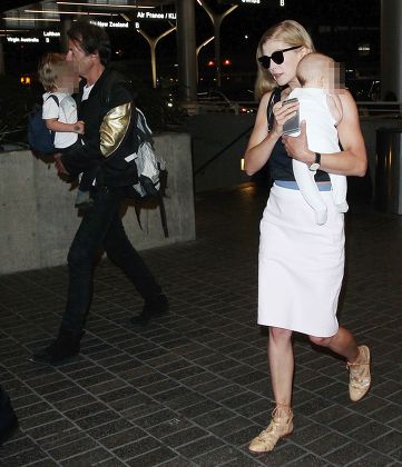 Rosamund Pike and family at the Los Angeles International Airport, America - 11 Apr 2015