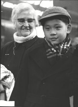 Salvation Army Major Catherine Smith With Ten-year-old Chew Ah-tsai Known As Jackie. Five Years Ago Miss Smith Broke Salvation Army Rules To Bring Him Back To Britain From An Orphanage She Started In Malaya. For Full Caption See Version. Box 0581 120