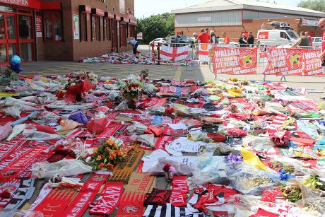 One minute silence for Walsall football fans Joel Richards, Adrian Evans and Charles 'Pat' Evans who were killed in Tunisia, Walsall, Britain - 03 Jul 2015