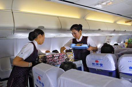 Chinese Flight Attendants Serving Lunch Editorial Stock Photo - Stock ...