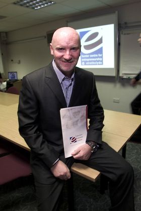TOM HUNTER, WHO HAS PROMISED TO MATCH THE PROCEEDS OF THE BAND AID 20 SINGLE AND DVD UP TO SEVEN MILLION POUNDS, BRITAIN - DEC 2004