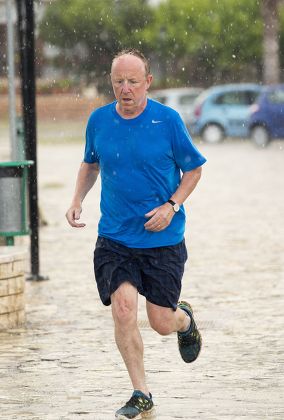 Man Running Through Torrential Rain Hail Editorial Stock Photo - Stock
