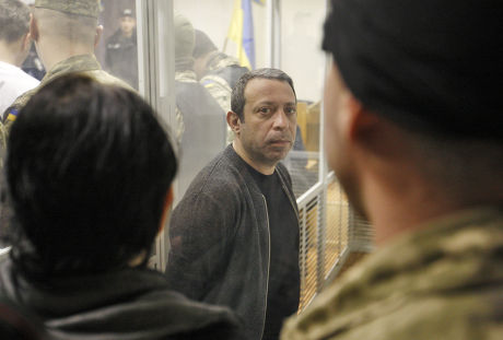UKROP party leader Hennadiy Korban inside a cage during his trial
