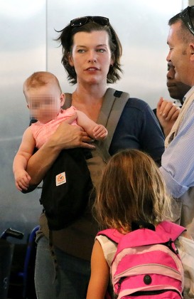 Milla Jovovich and family at Cape Town Airport, South Africa - 10 Dec 2015