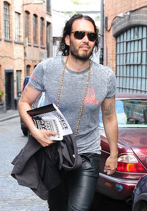 Russell Brand Leaves His House In East London The Afternoon After Ed Milliband Was Spotted Leaving His House In The Evening Of Monday 27th Of April Weeks Before The Election. Russell Was Holding Two Books One On Greece And One On Austerity.