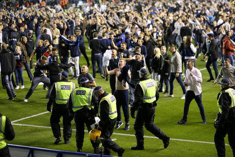 A Millwall fan invades the pitch late in the game, during the Sky Bet  League One Play-Off Semi Final, Second Leg match at The Den, London Stock  Photo - Alamy