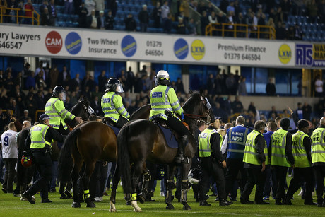 A Millwall fan invades the pitch late in the game, during the Sky Bet  League One Play-Off Semi Final, Second Leg match at The Den, London Stock  Photo - Alamy