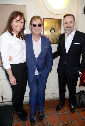 Anne Aslett with Sir Elton John and David Furnish