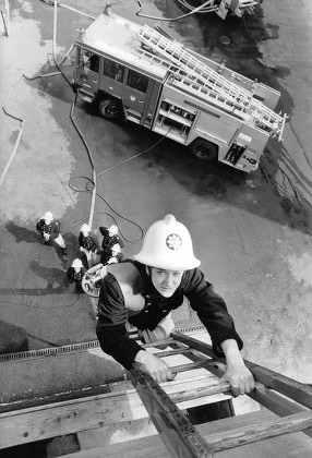 Tv Programme: London's Burning. Actress Katharine Rogers Climbing A Fireman's Ladder. Box 650 304121564 A.jpg.