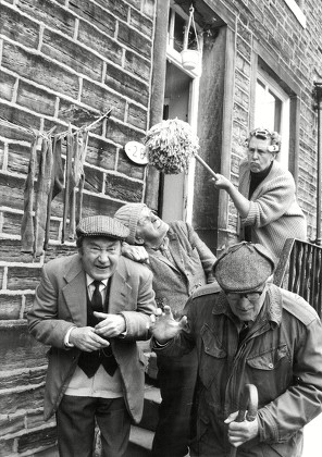 Tv Programme: Last Of The Summer Wine. Nora Batty (kathy Staff) Waving Her Mop At Compo (bill Owen) Centre Clegg (peter Sallis) Left And Foggy (brian Wilde) Right. Box 650 404121544 A.jpg.